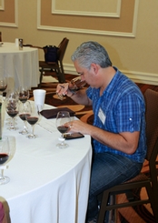 Maurice DiMarino, sommelier and wine buyer at San Diego's Island Prime, noses a wine.